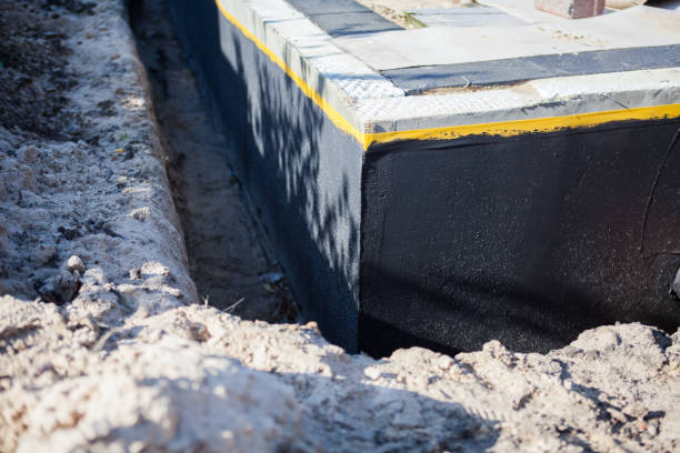 Professional Waterproofing technician working in Mears, MI
